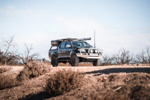 black toyota hilux ute with roof racks
