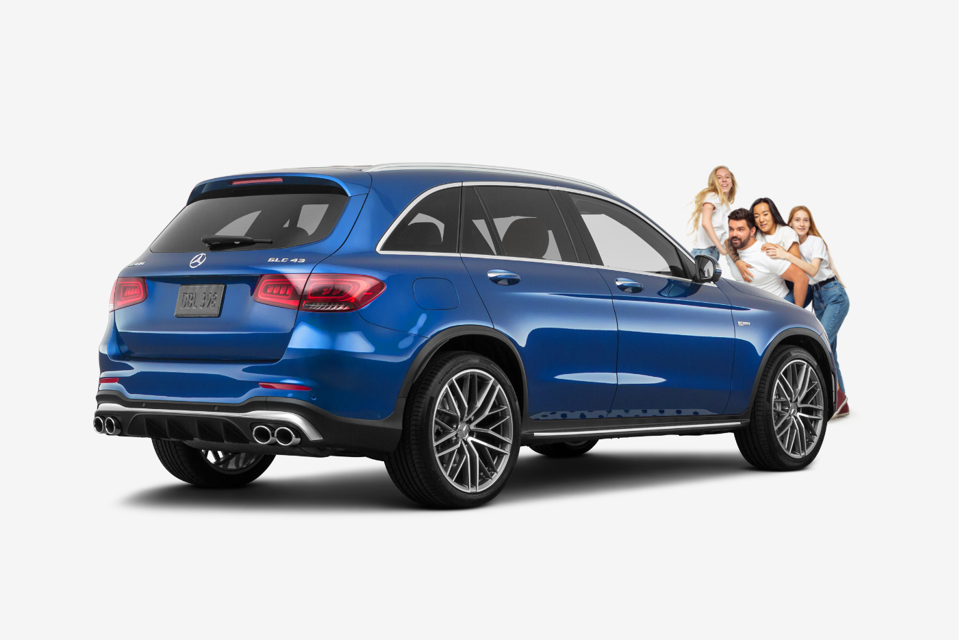family standing in front of a blue mercedes benz GLC43
